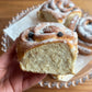 close up Chelsea bun in hand