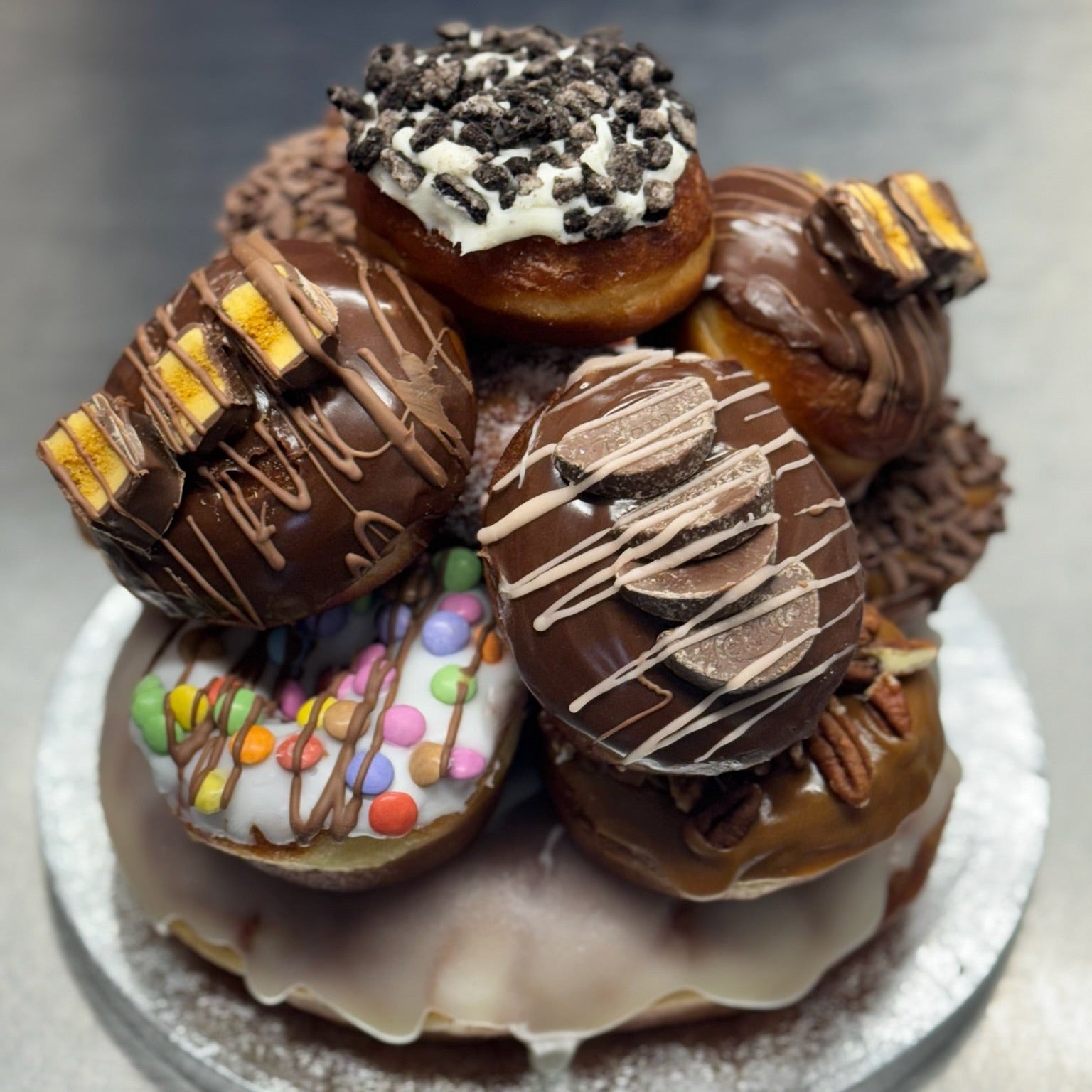 A doughnut tower of topped and filled doughnuts
