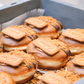 Lotus Biscoff Doughnut - A decadent ball doughnut oozing with Biscoff cream topped with lotus biscuit