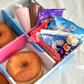 DIY doughnut kit with fresh ring doughnuts and delicious toppings
